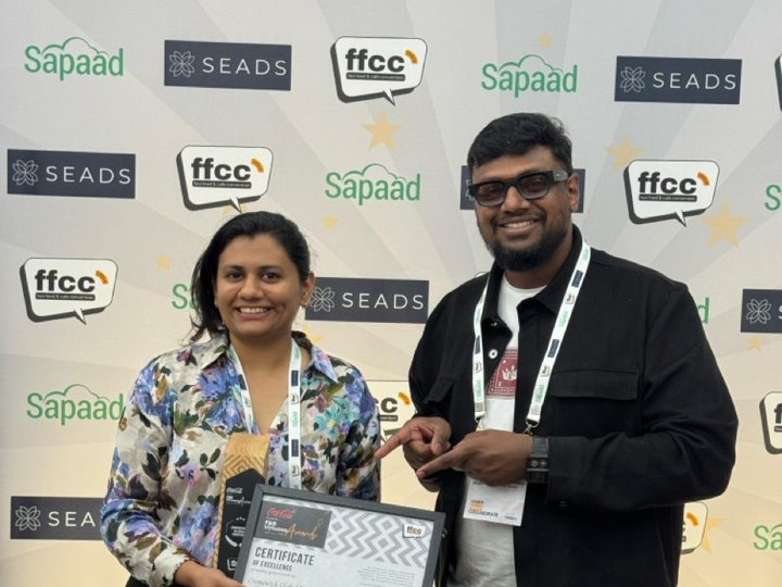 Ruchika, founder of Cremewich, receiving an award