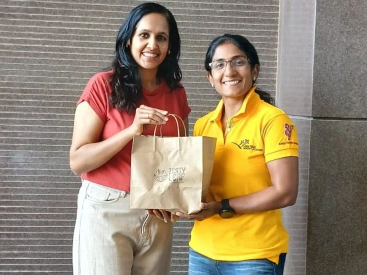 Sona N, founder of Zesty Leaf, with the Zesty Leaf brand bag